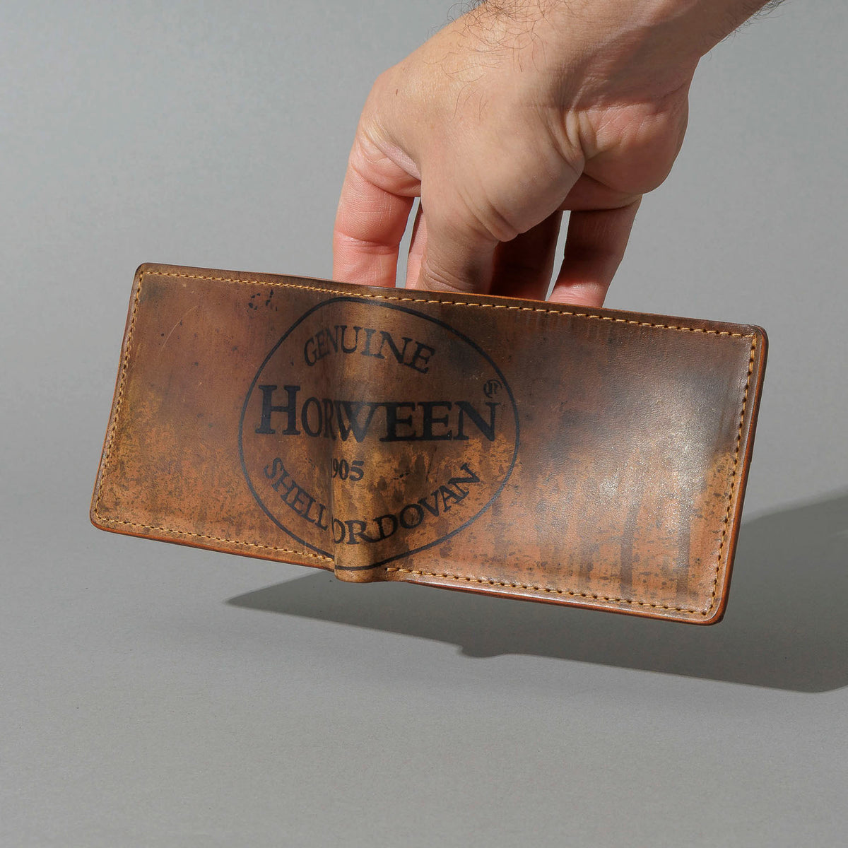 One-Off Johnny the Fox in Hand-Glazed Epic Reverse Cigar Shell Cordovan, held open in hand, shot 1
