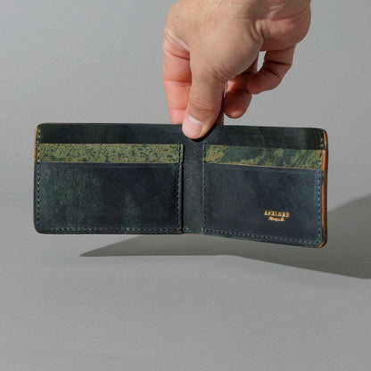 One-Off Nicky Slim in Hand-Glazed Epic Splatter Reverse Green Shell Cordovan, held open in hand, shot 2