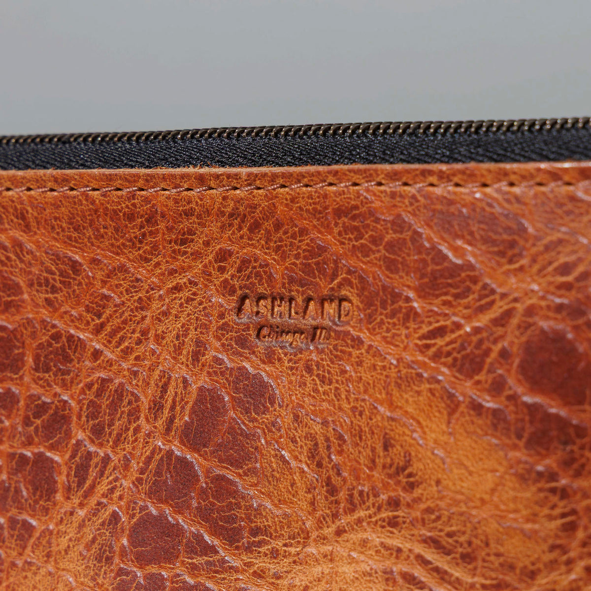 One-Off Prototype Pouch in Hammered Olive Tanned, close-up of the logo patch