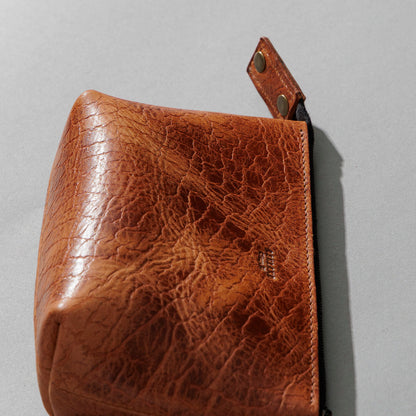 One-Off Prototype Pouch in Hammered Olive Tanned, angled view lying flat, shot 4
