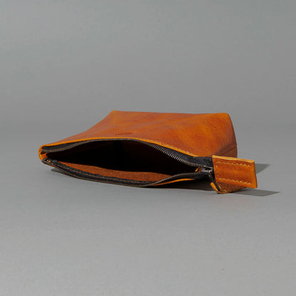 One-Off Prototype Pouch in Acorn Aspen Horsehide, angled view lying flat, shot 1