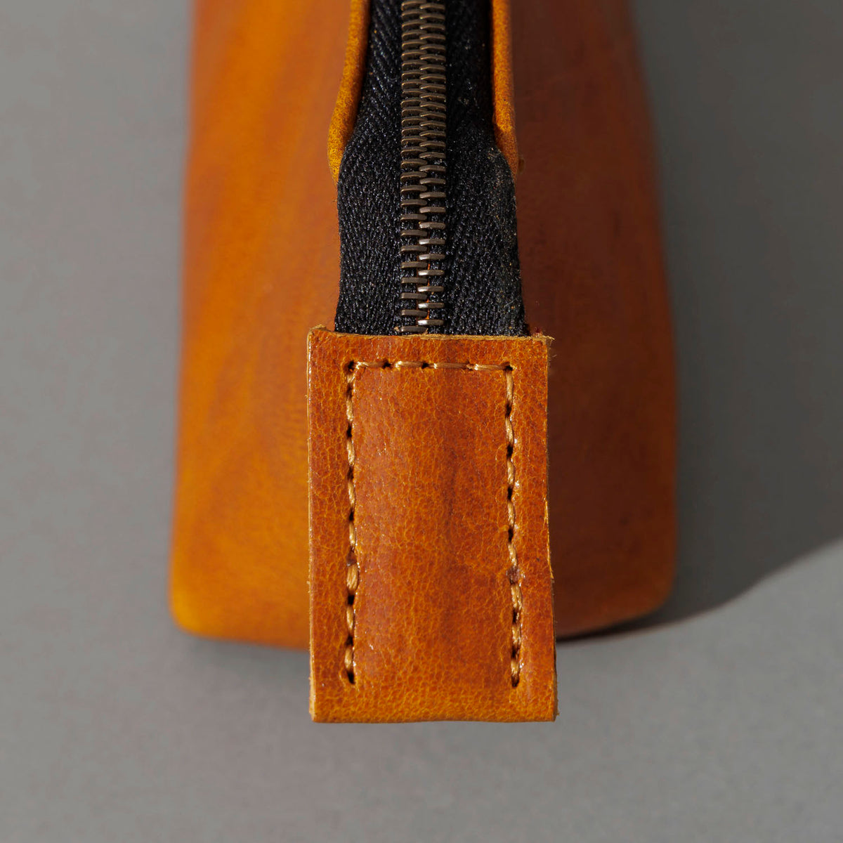 One-Off Prototype Pouch in Acorn Aspen Horsehide, close-up of the zipper, shot 2