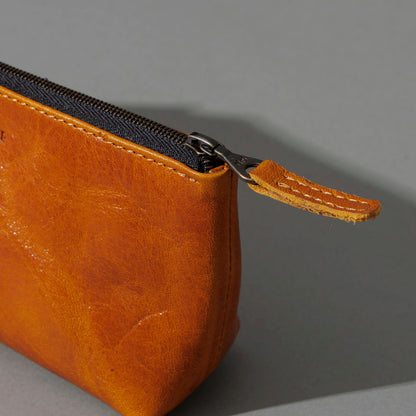 One-Off Prototype Pouch in Acorn Aspen Horsehide, angled view lying flat, shot 4