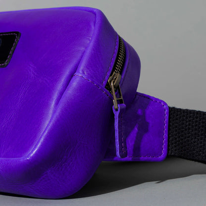 One-Off Sling Bag in Violet Latigo, angled view lying flat, shot 2
