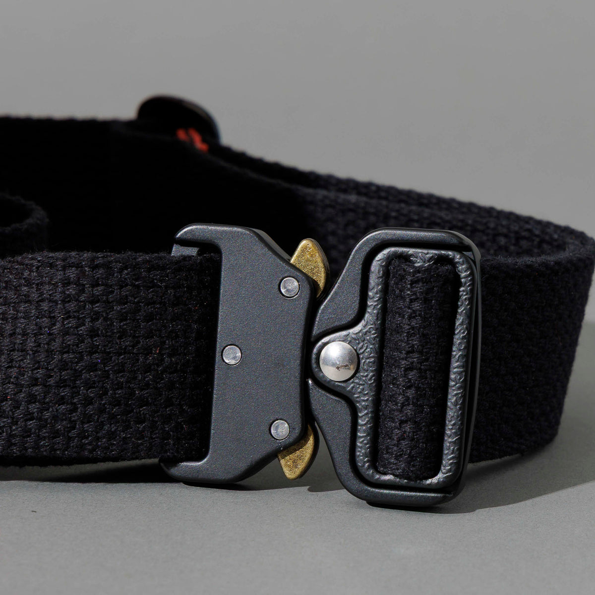 One-Off Sling Bag in Red Latigo, close-up of the metal buckle and strap