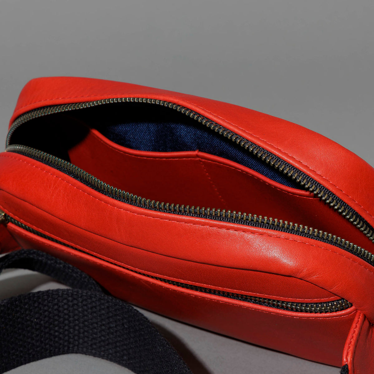 One-Off Sling Bag in Red Latigo, unzipped, showing interior