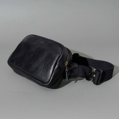 Sling Bag in Black Aspen Horsehide, angled view lying flat, shot 3