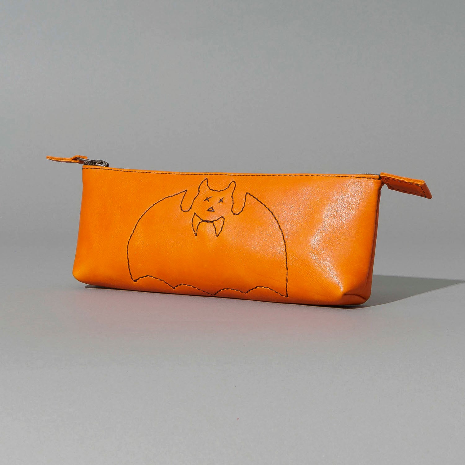 One-Off Zipper Pouch in Orange Latigo, Bat Embroidery, close-up of the embroidery, shot 1