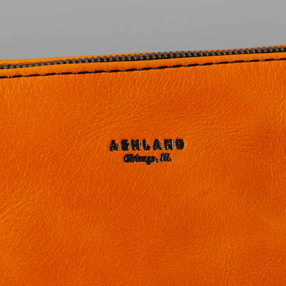 One-Off Zipper Pouch in Orange Latigo, Bat Embroidery, close-up of the logo patch