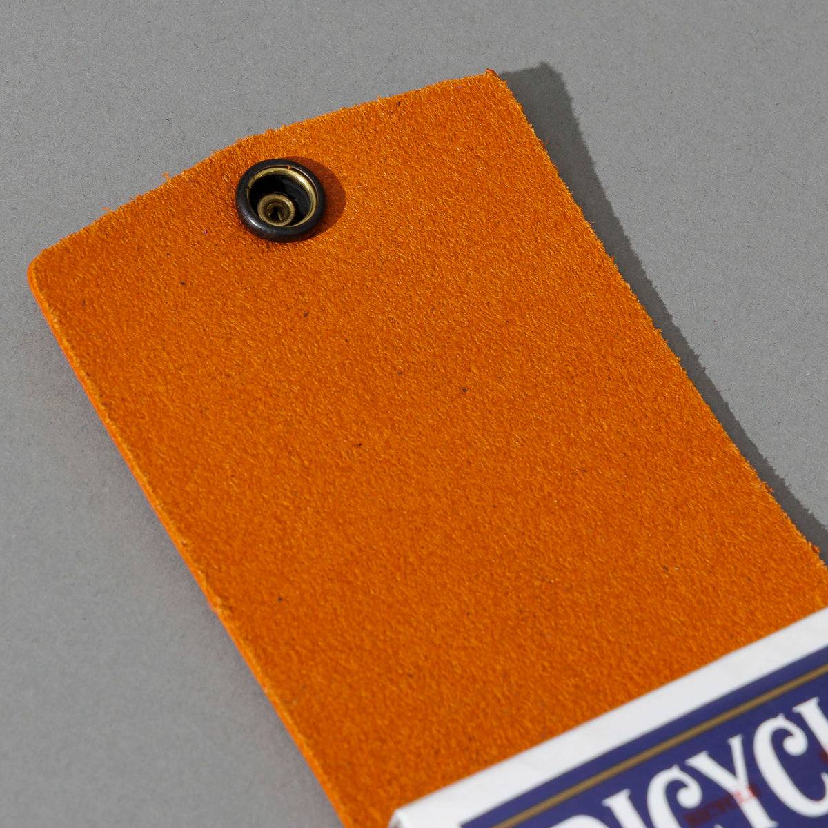 Leather Playing Card Case in Orange Latigo, open with a deck of playing cards, shot 4