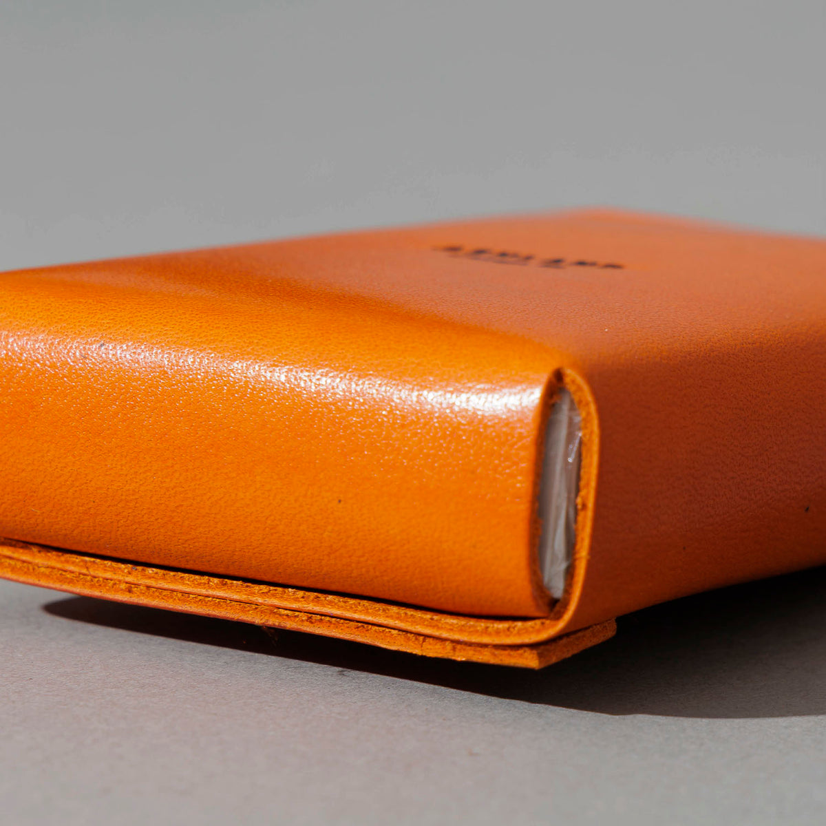 Leather Playing Card Case in Orange Latigo, side profile view