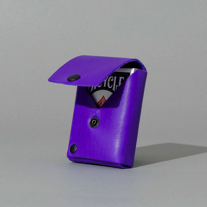 Leather Playing Card Case in Violet Latigo, open with a deck of playing cards, shot 1
