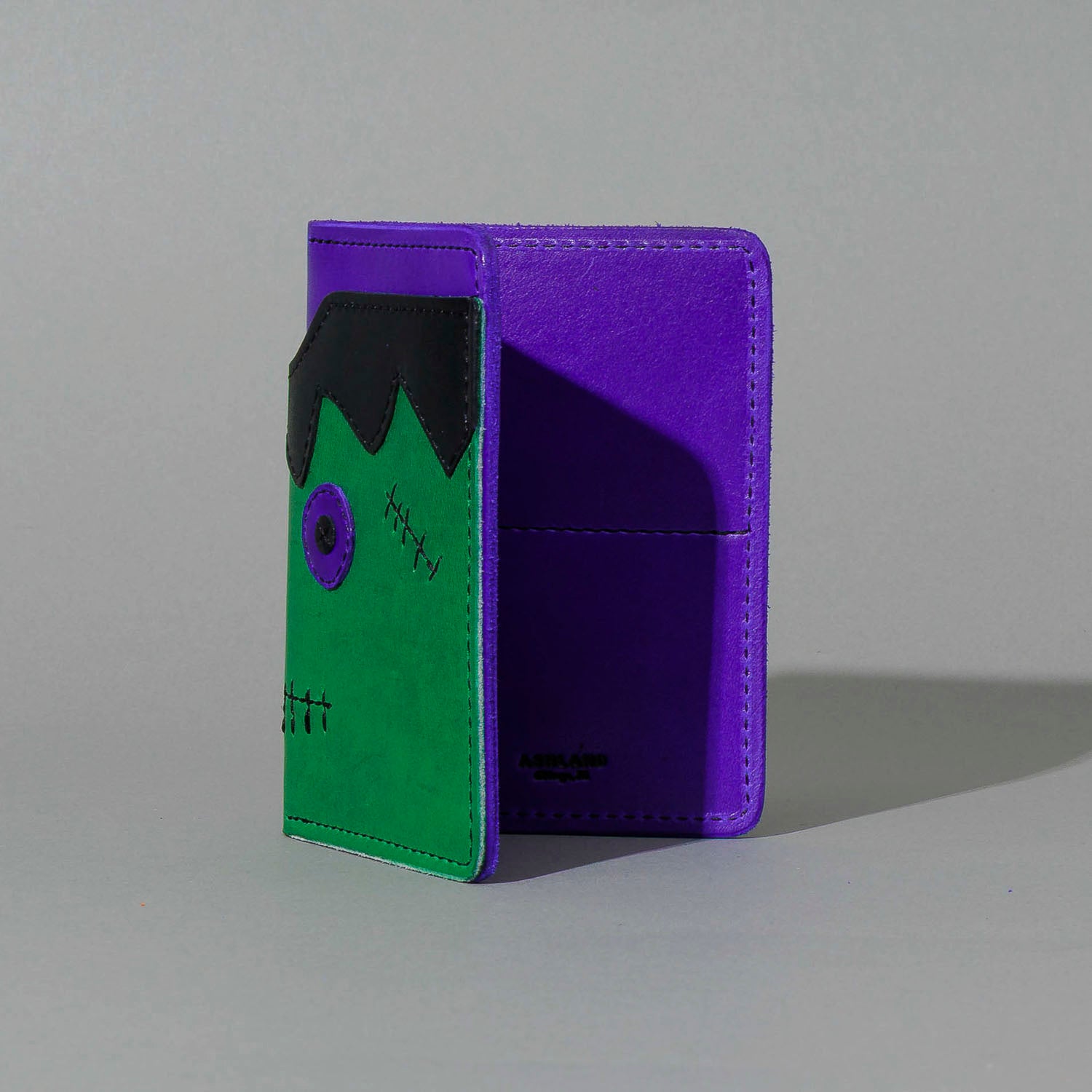 One-Off Fat Herbie in Green and Violet Latigo, Frankenstein Embroidery, standing upright, side angle, shot 1