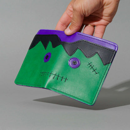 One-Off Fat Herbie in Green and Violet Latigo, Frankenstein Embroidery, held open in hand