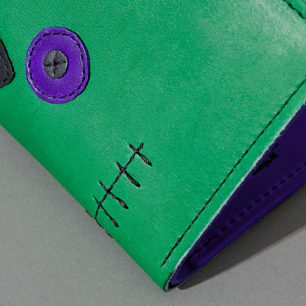 One-Off Fat Herbie in Green and Violet Latigo, Frankenstein Embroidery, close-up of the embroidery, shot 2