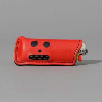 One-Off Skeleton Lighter in Red Latigo, skeleton face design, front view, shot 1