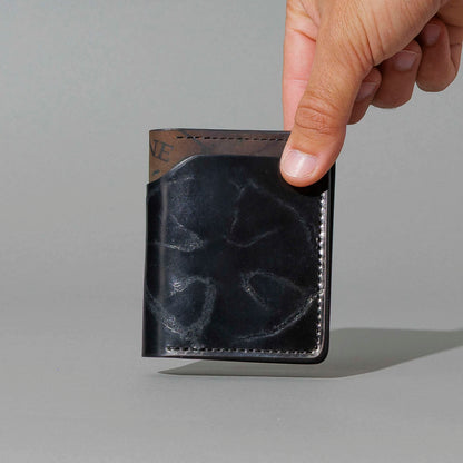 One-Off Tony the Ant in Branded Black and Reverse Shell Cordovan, Number Six Embroidery, held in hand, shot 1