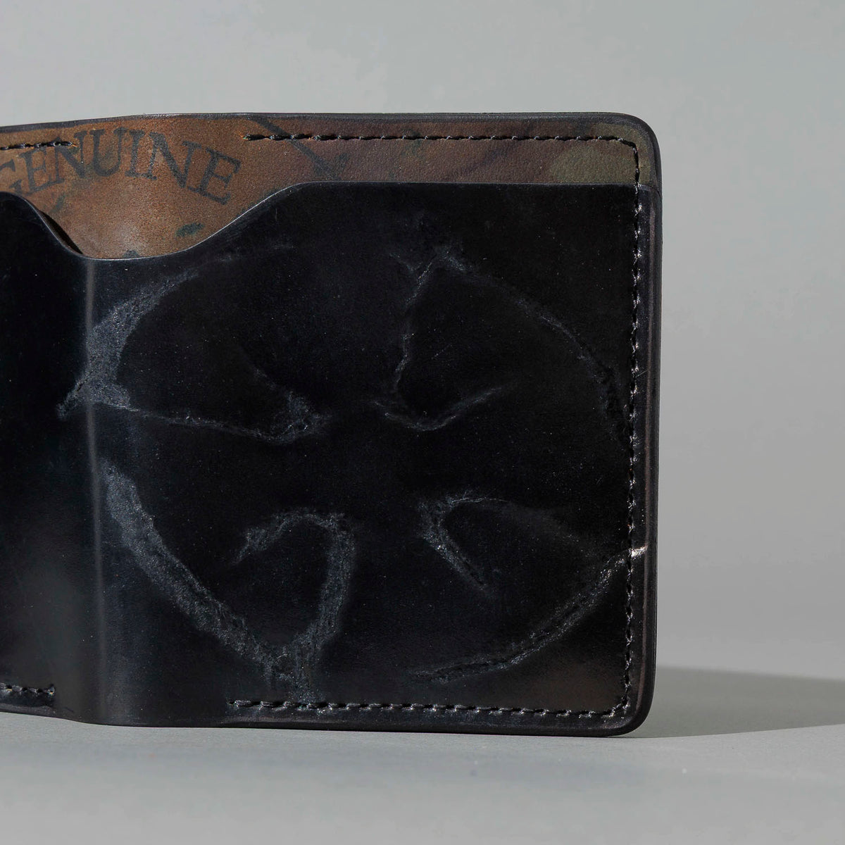 One-Off Tony the Ant in Branded Black and Reverse Shell Cordovan, Number Six Embroidery, angled view lying flat, shot 2
