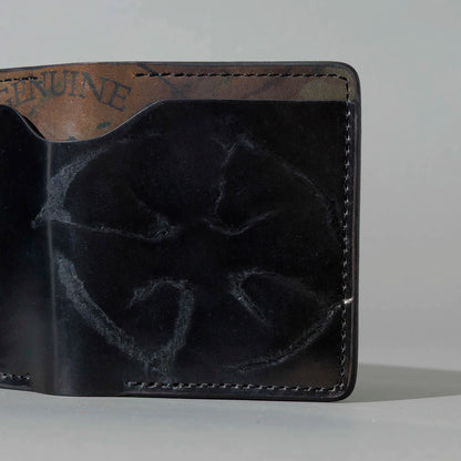 One-Off Tony the Ant in Branded Black and Reverse Shell Cordovan, Number Six Embroidery, angled view lying flat, shot 2