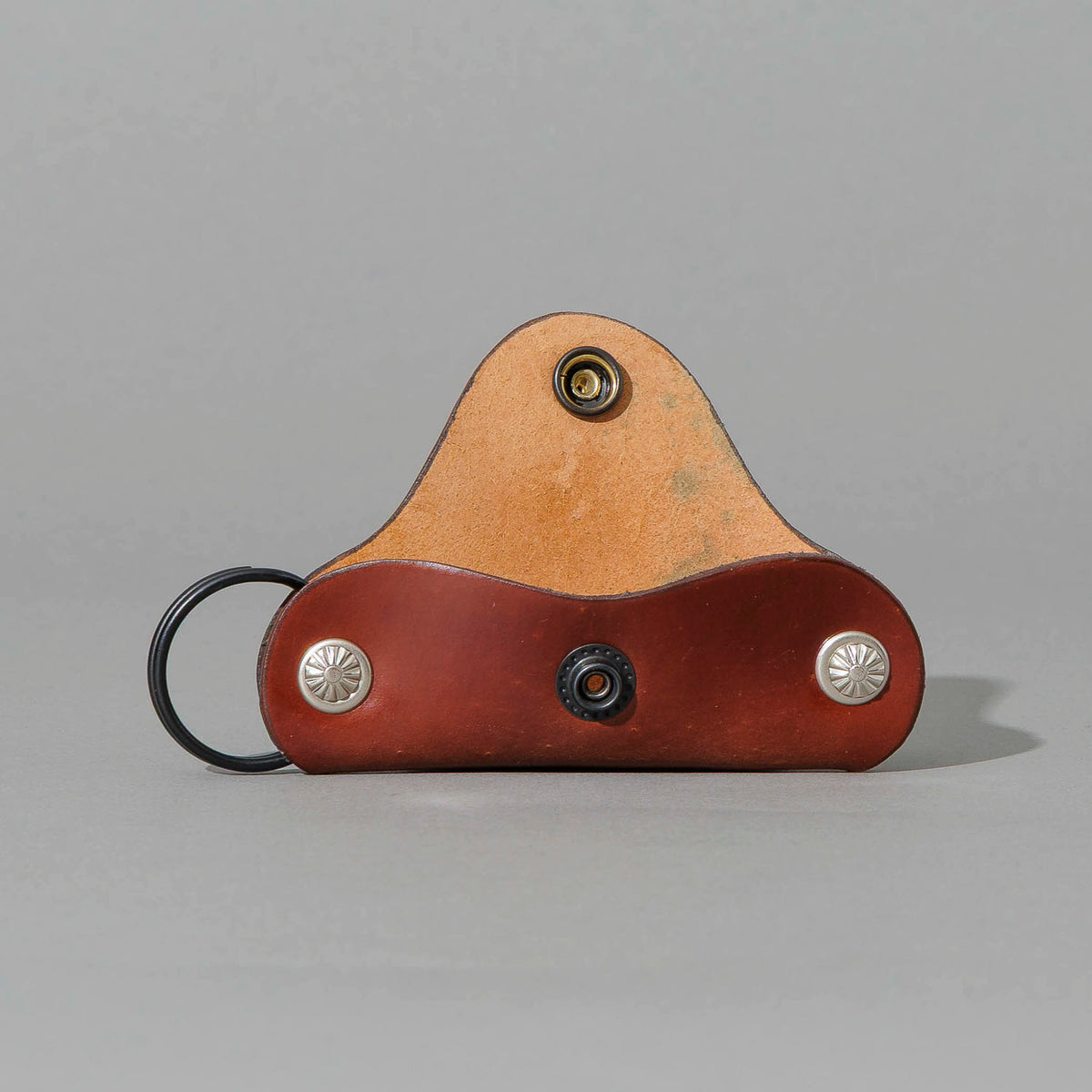 Vault Key Holder in Blood Orange Shell Cordovan, opened to show where keys sit, shot 1
