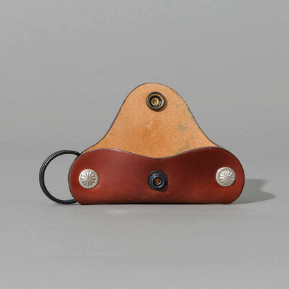 Vault Key Holder in Blood Orange Shell Cordovan, opened to show where keys sit, shot 1