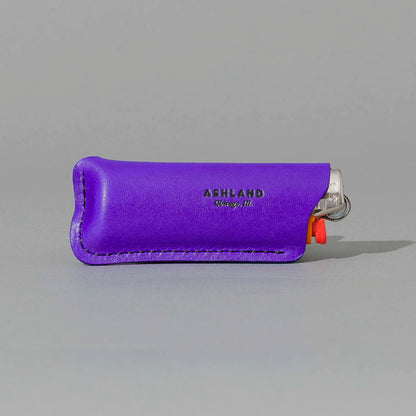 Lighter in Violet Latigo, angled view lying flat, shot 1