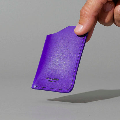 One-Shot Card Case in Violet Latigo, held in hand, shot 2