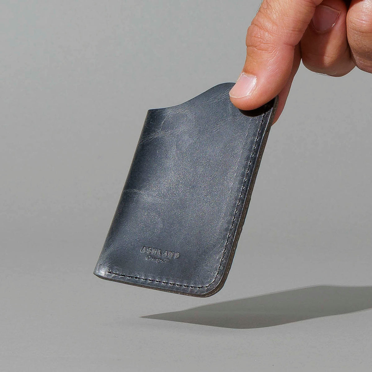 One-Shot Card Case in Slate Vintage, held in hand, shot 2
