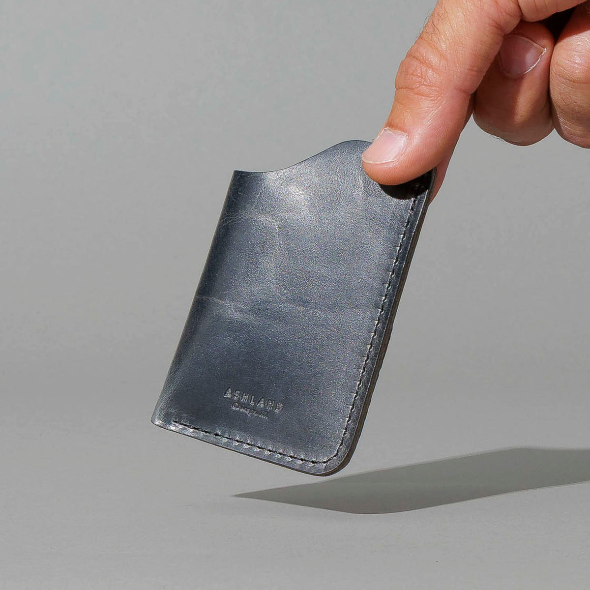 One-Shot Card Case in Slate Vintage, held in hand, shot 3