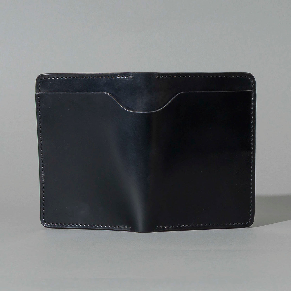 One-Off Traveler Passport Holder in Black Shell Cordovan with Red Pentagram Embroidery, back view