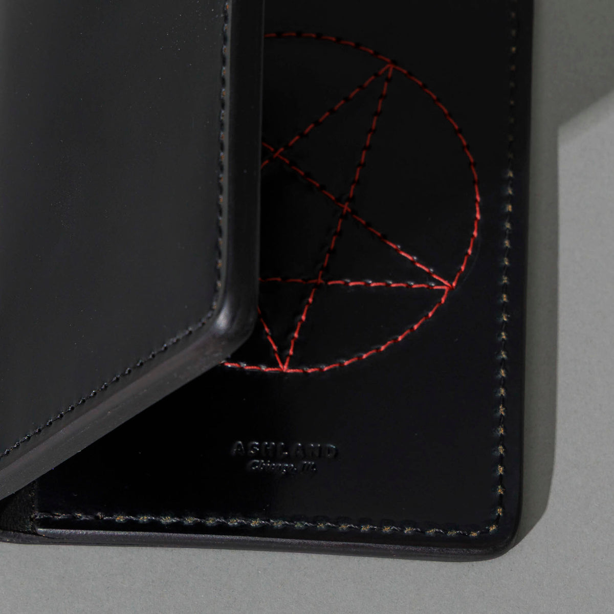One-Off Traveler Passport Holder in Black Shell Cordovan with Red Pentagram Embroidery, close-up detail, shot 3