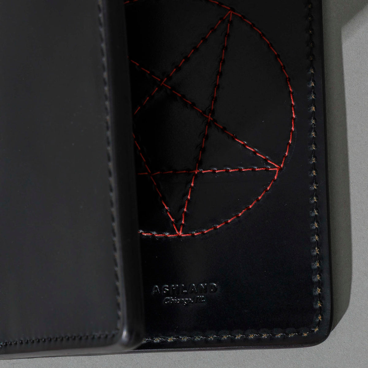 One-Off Traveler Passport Holder in Black Shell Cordovan with Red Pentagram Embroidery, close-up detail, shot 2