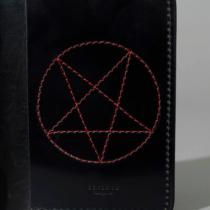 One-Off Traveler Passport Holder in Black Shell Cordovan with Red Pentagram Embroidery, close-up of the embroidery, shot 1