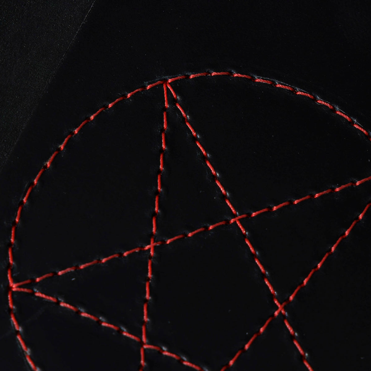 One-Off Traveler Passport Holder in Black Shell Cordovan with Red Pentagram Embroidery, close-up of the embroidery, shot 2