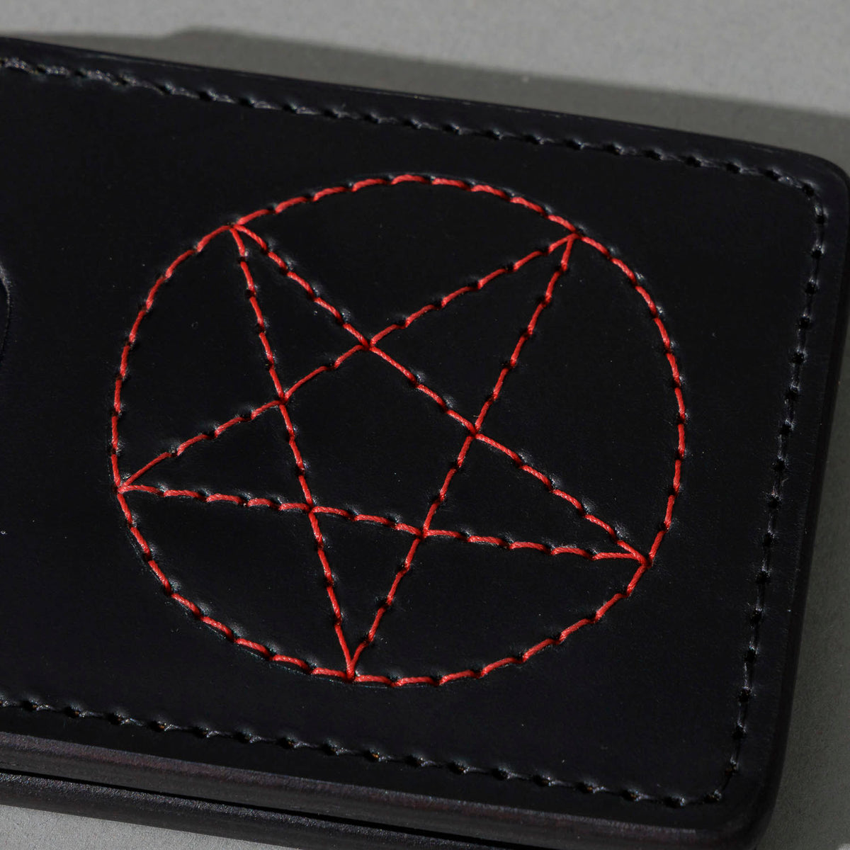 One-Off Capone Money Clip in Black Shell Cordovan with Red Pentagram Embroidery, close-up of the embroidery