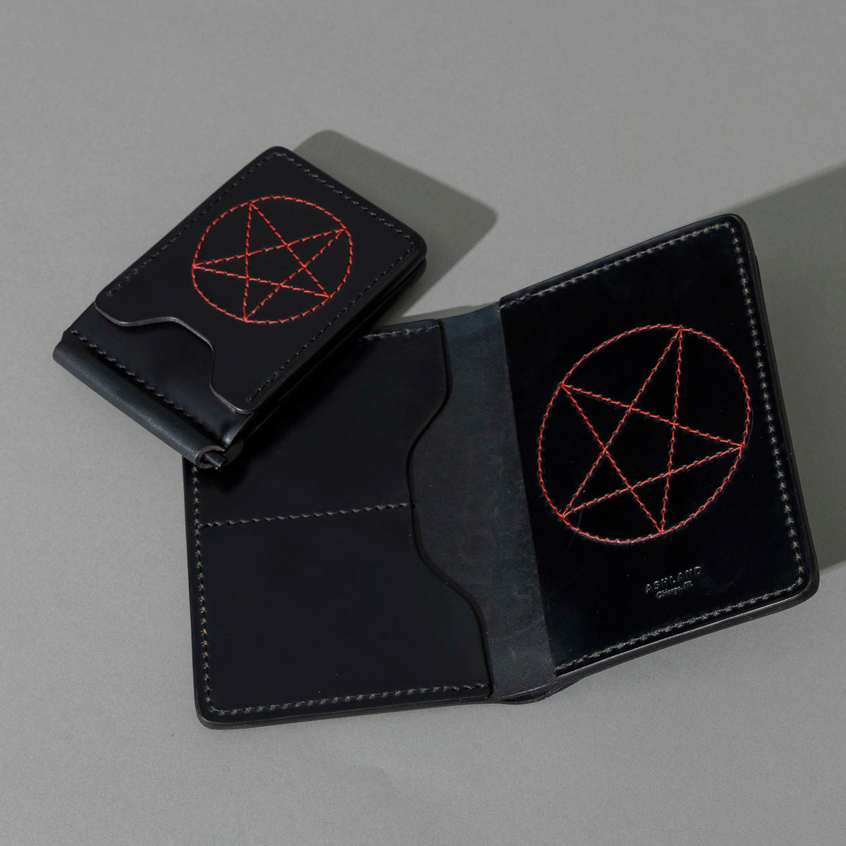 One-Off Traveler Passport Holder in Black Shell Cordovan, group shot with other Fall Limited Release pieces, shot 2