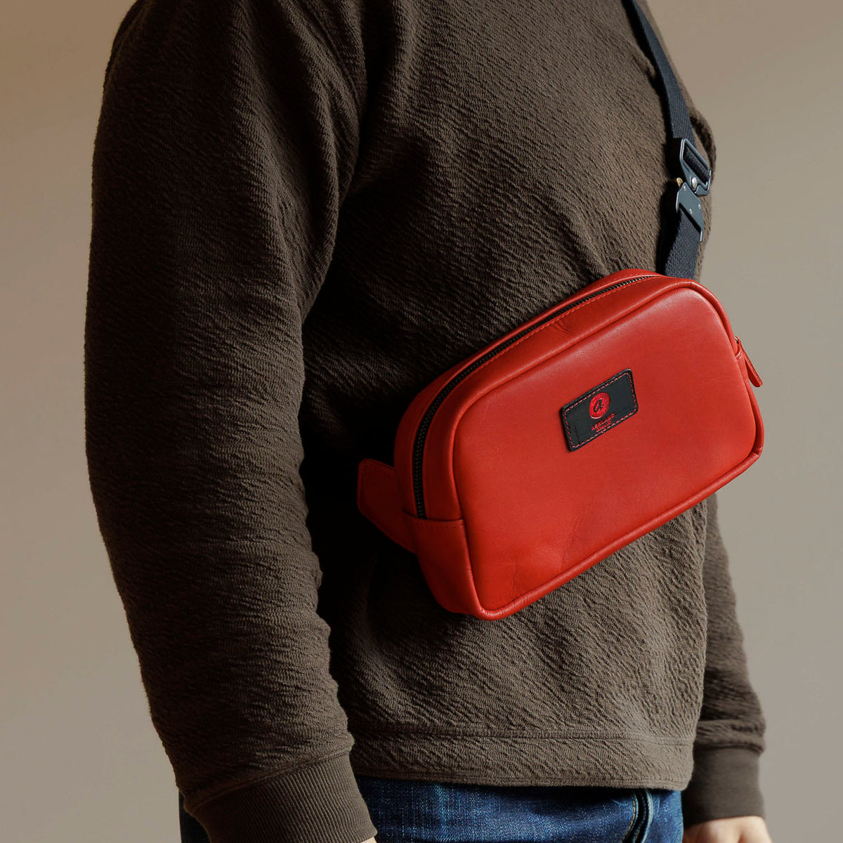 One-Off Sling Bag in Red Latigo, worn crossbody by a model, shot 2