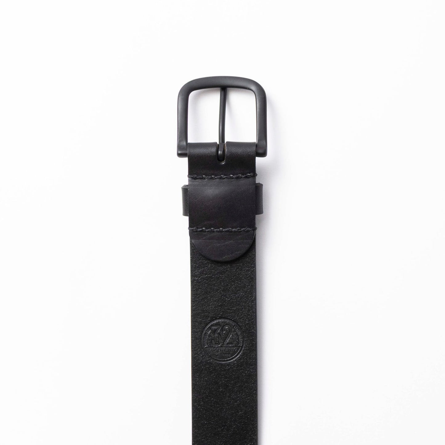 Black leather belt with a black buckle on a white background