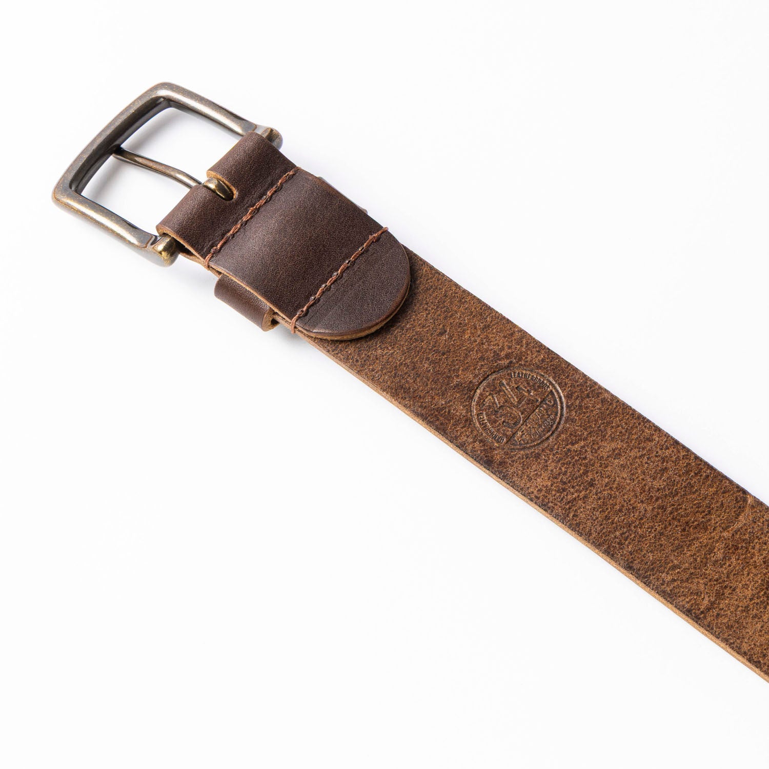 Brown leather belt with a silver buckle on a white background