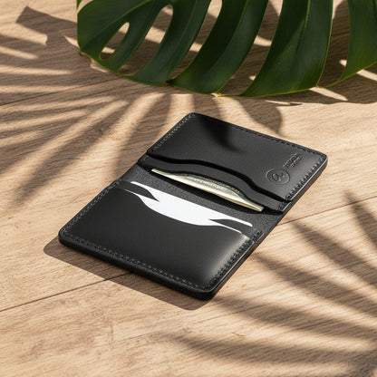 Black cardholder with a card inserted on a white background
