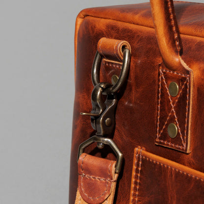 Close-up of the front pocket hardware clip on the Ashland Leather LaSalle Briefcase
