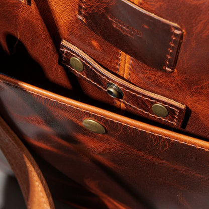 Close-up of the handle base stitching and rivets on the Ashland Leather LaSalle Briefcase