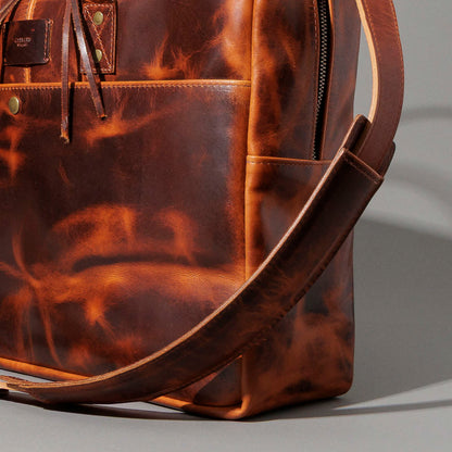Ashland Leather LaSalle Briefcase, side view product shot with strap draped
