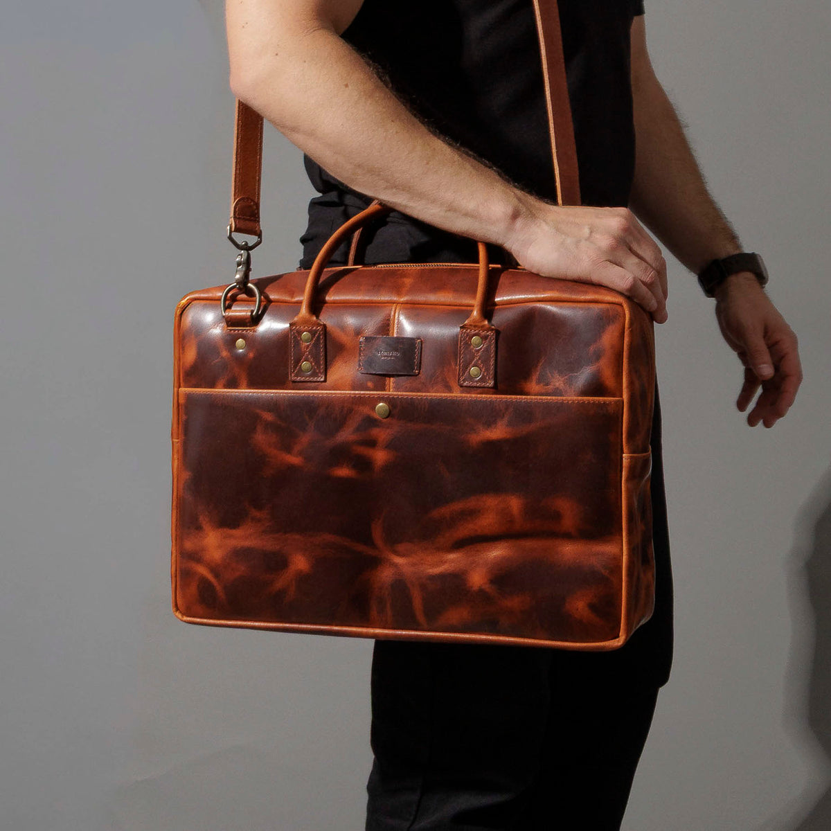 Model wearing the Ashland Leather LaSalle Briefcase on its adjustable shoulder strap