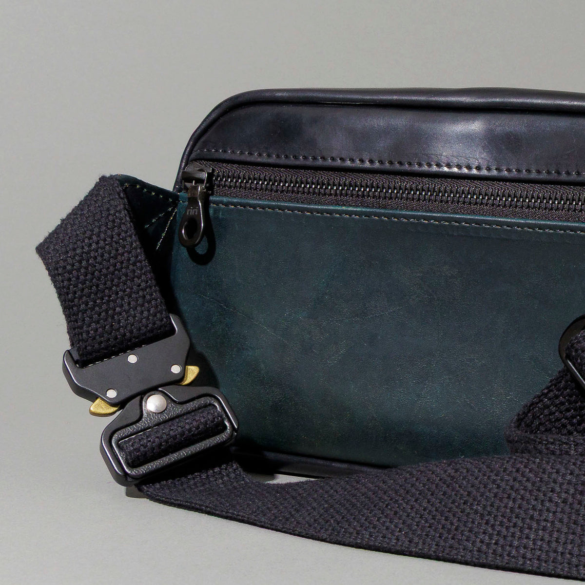 Ashland Leather Sling Bag exterior back pocket and coiled adjustable strap, black Shell Cordovan