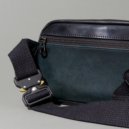 Ashland Leather Sling Bag exterior back pocket and coiled adjustable strap, black Shell Cordovan