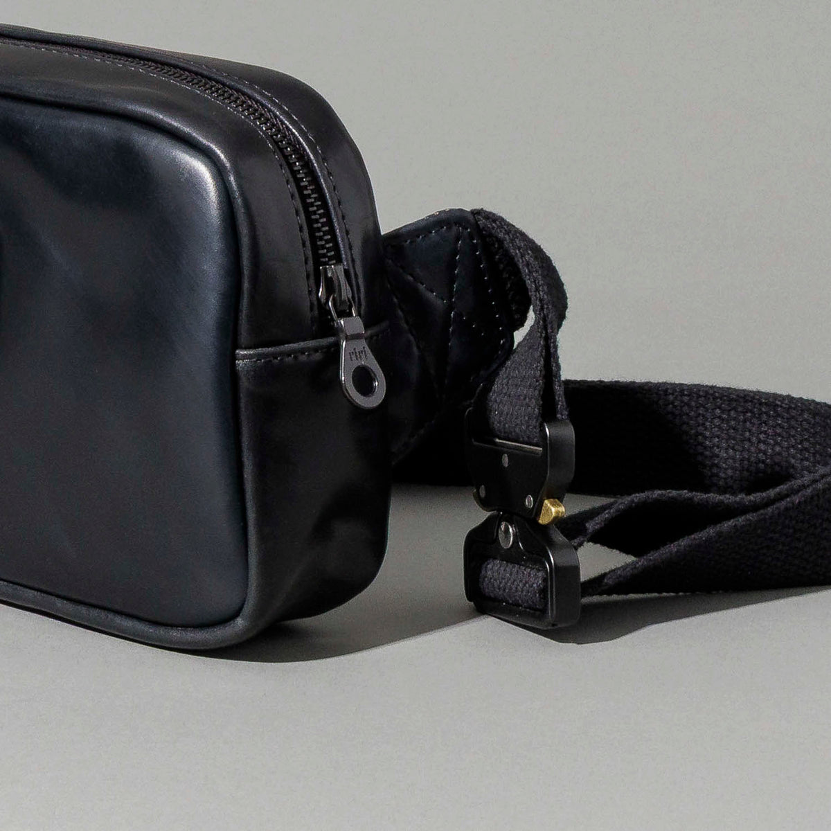 Ashland Leather black Shell Cordovan Sling Bag, straight-on front product shot