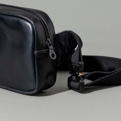 Ashland Leather black Shell Cordovan Sling Bag, straight-on front product shot