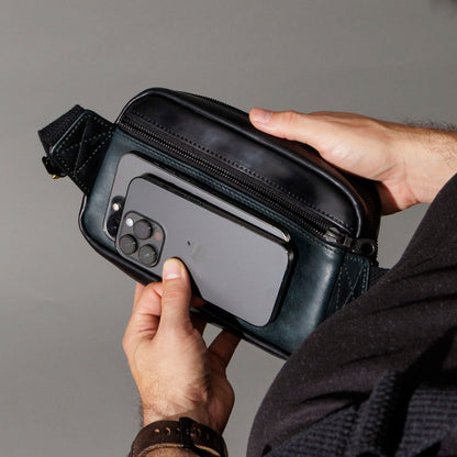 Securing the Ashland Leather Sling Bag while worn crossbody