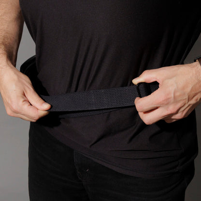 Adjusting the crossbody strap buckle on the Ashland Leather Sling Bag at the hip